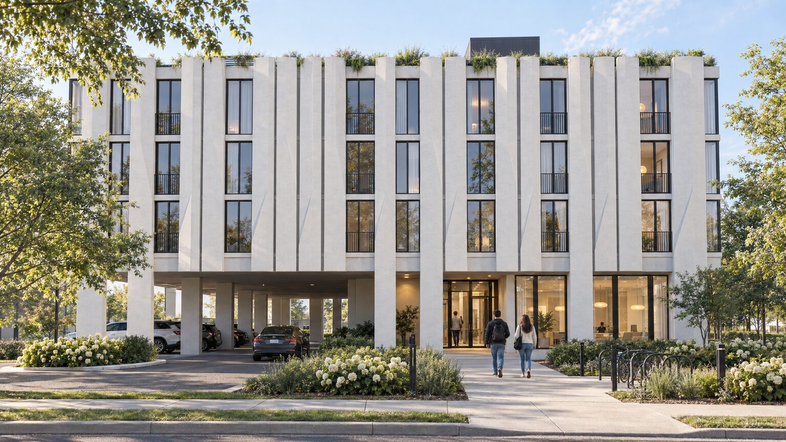 Architectural visualization of the west entrance: a recessed door under a lit canopy, a barrier-free path and bicycle racks, with covered parking alongside.